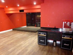 Red Home Theater with Riser and Marshall Fridges