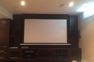 4. Projection Screen Drops Down in Front of TV