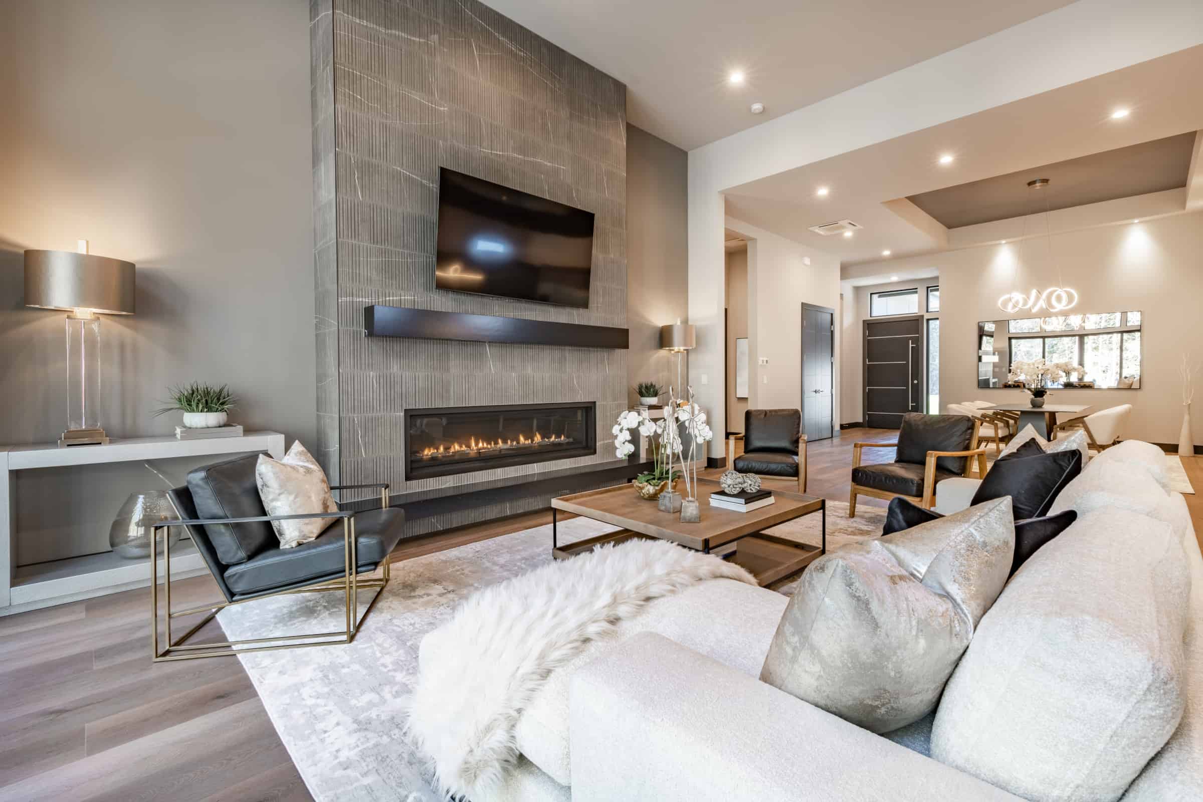 Tv wall mounting service showcasing a Samsung TV above a fireplace in family room
