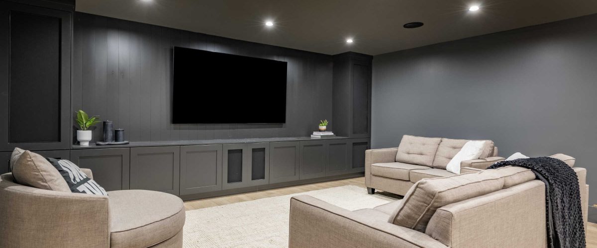 Interior,Media,Room,With,Dark,Grey,Walls,Comfortable,Furniture,And